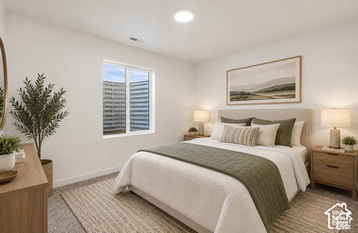 White walls complement the light-toned wood-finish flooring