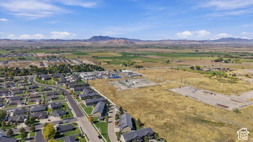 Expansive residential area with a range of housing styles, established streets, and surrounding undeveloped land