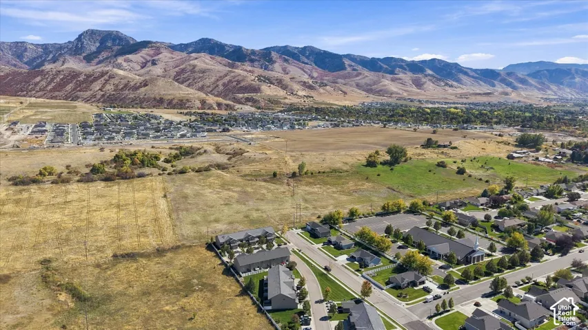 Expansive mountain range backdrop and surrounding residential developments