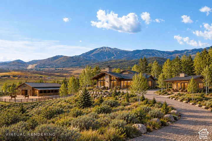 Modern mountain estate with natural wood and stone exterior, set on expansive grounds surrounded by mature evergreen and aspen trees