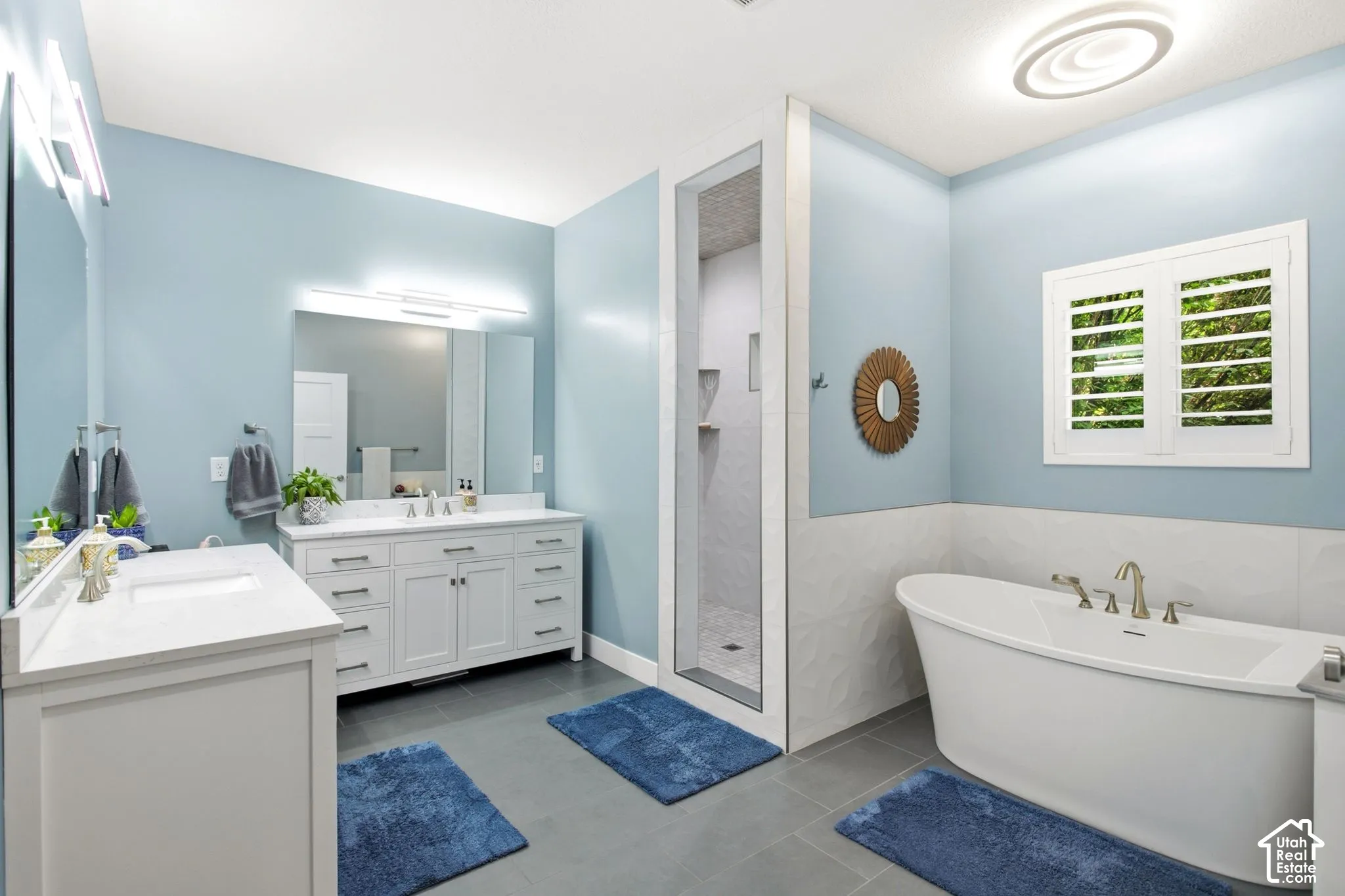 Primary en-suite with dual vanities, soaking tub and walk-in shower