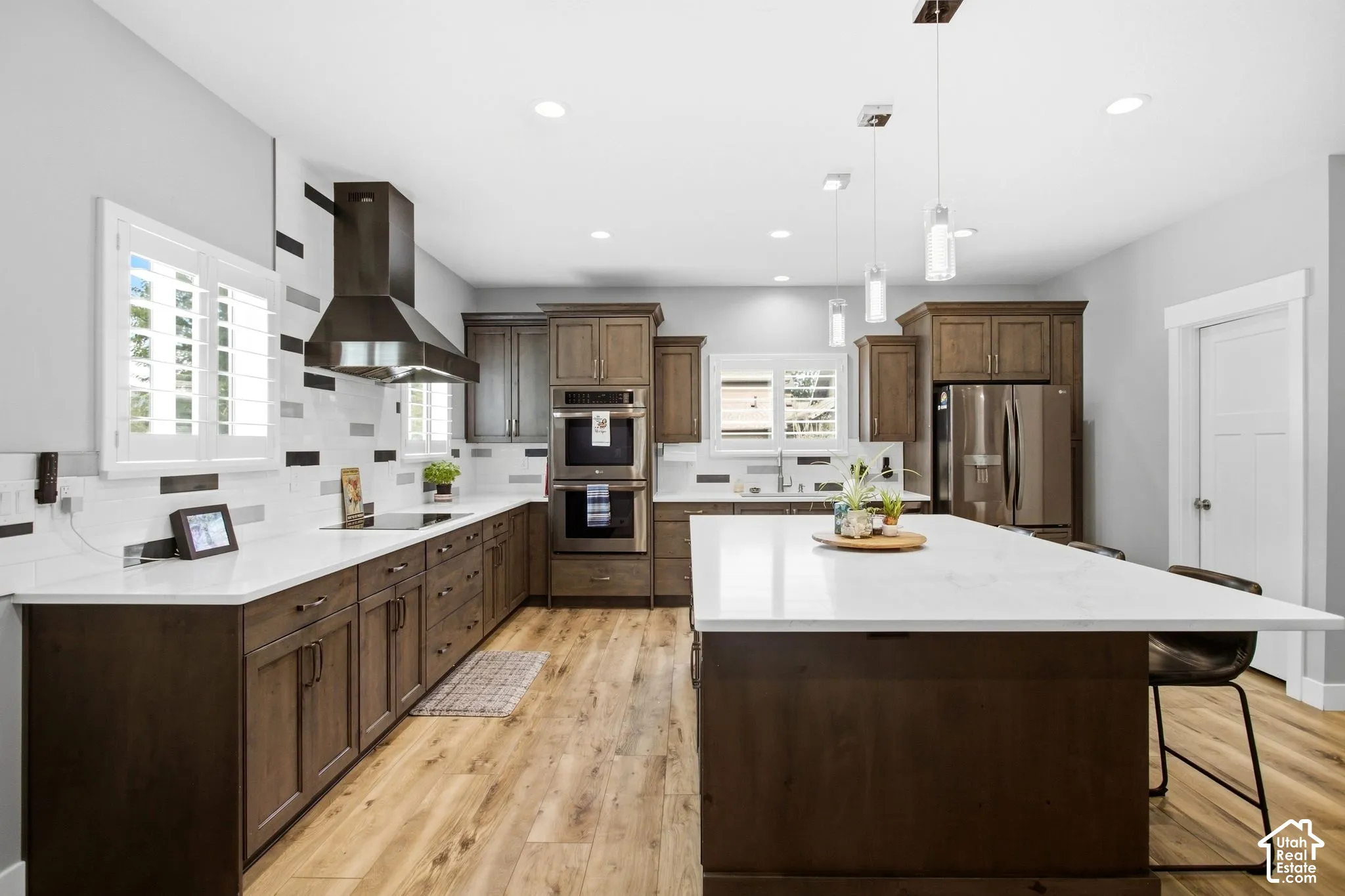 Expansive Quartz counter top areas great for preparing food, double ovens, refrigerator included