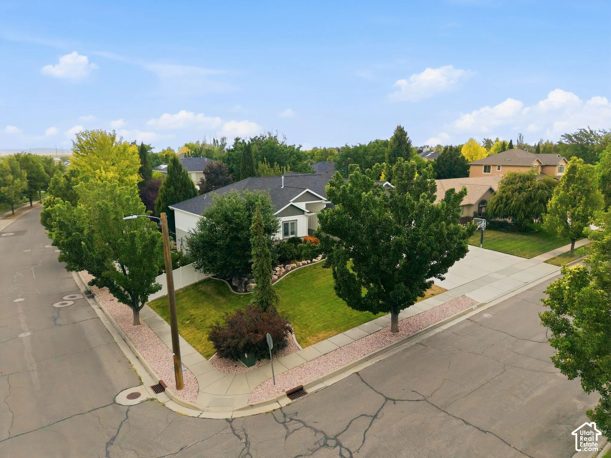 Aerial view of south side corner of home and yard