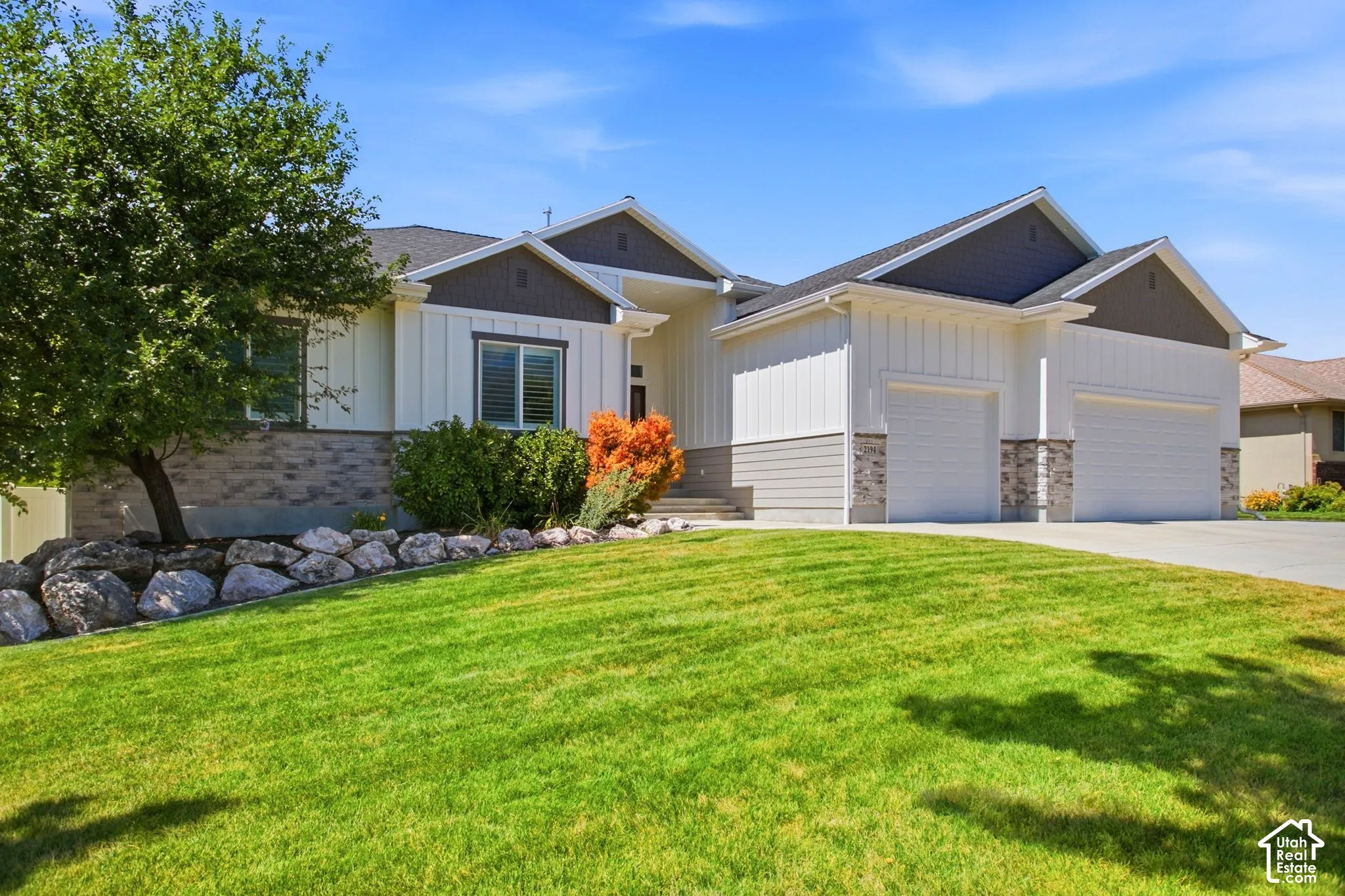 Contemporary Ranch style with Board and Batin and stone exterior-3 car garage