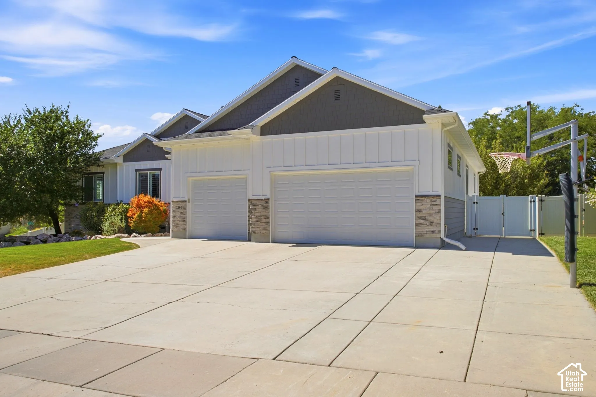 Spacious concrete driveway for extra parking, 3-car garage