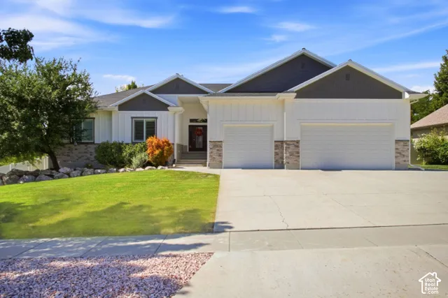 Contemporary Ranch style with Board and Batin and stone exterior-3 car garage