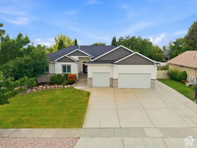 Rambler style home with 3-car garage and RV parking