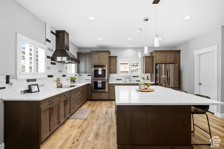 Expansive Quartz counter top areas great for preparing food, double ovens, refrigerator included