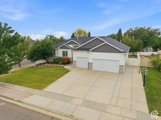 Rambler style home with 3-car garage and RV parking