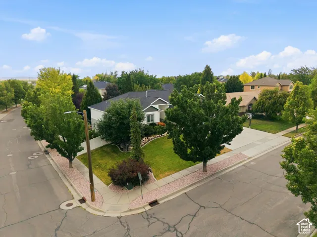 Aerial view of south side corner of home and yard