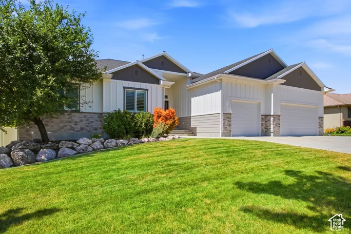 Contemporary Ranch style with Board and Batin and stone exterior-3 car garage