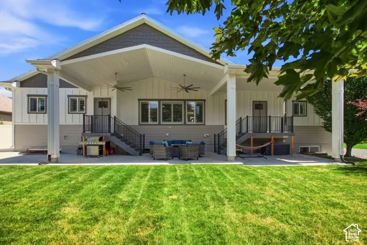 Expansive covered patio with separate entrances to kitchen and primary suite