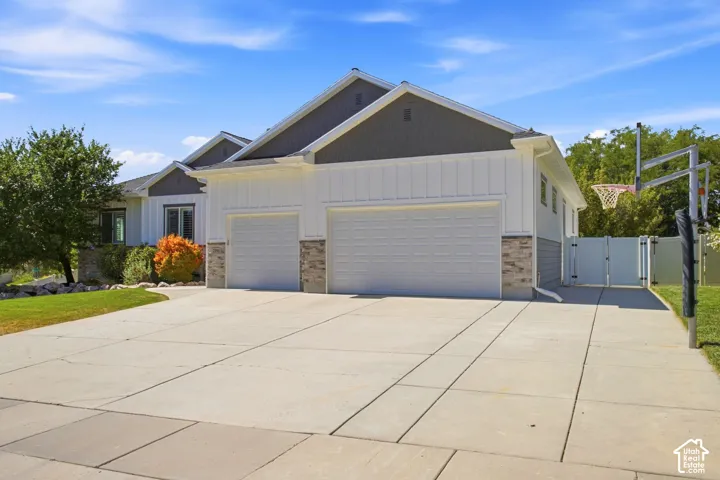 Spacious concrete driveway for extra parking, 3-car garage