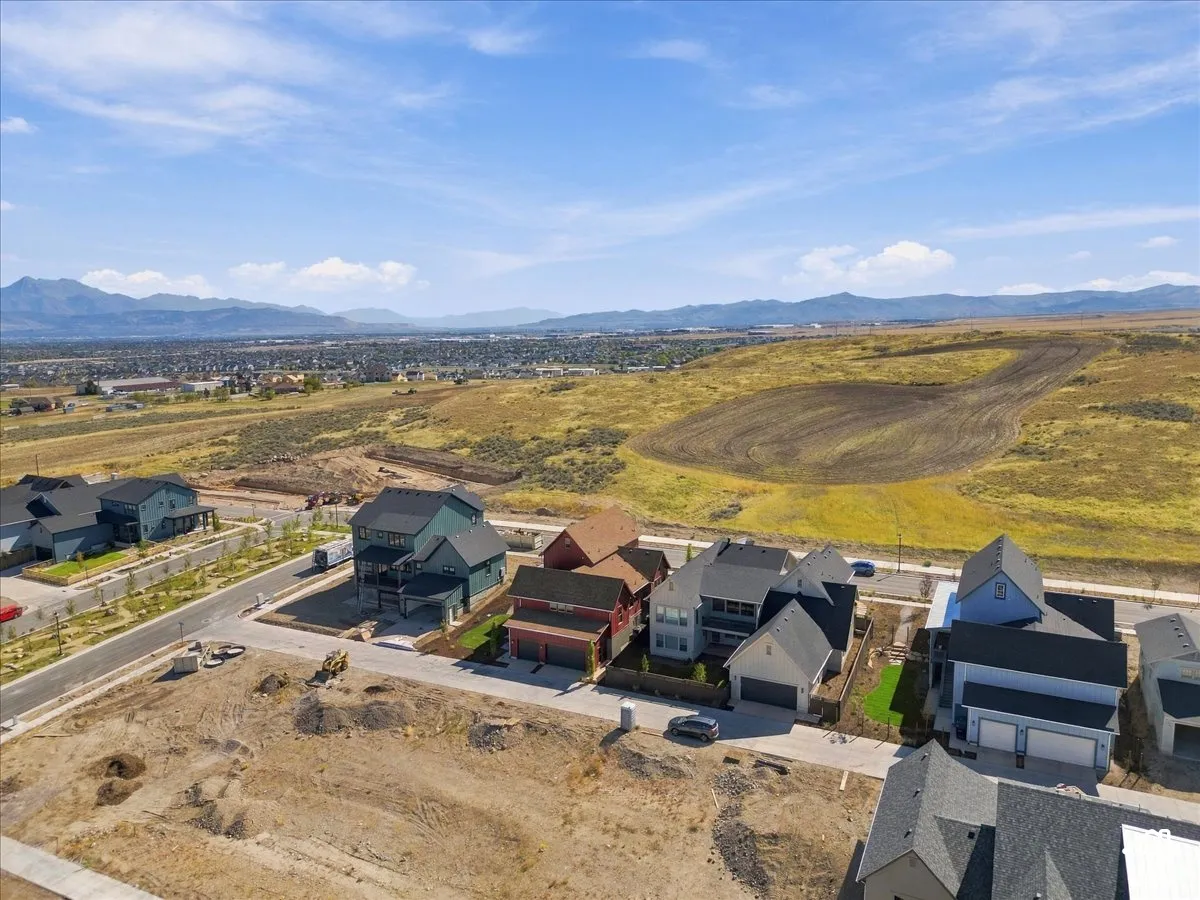 Mountain backdrop with a developing neighborhood