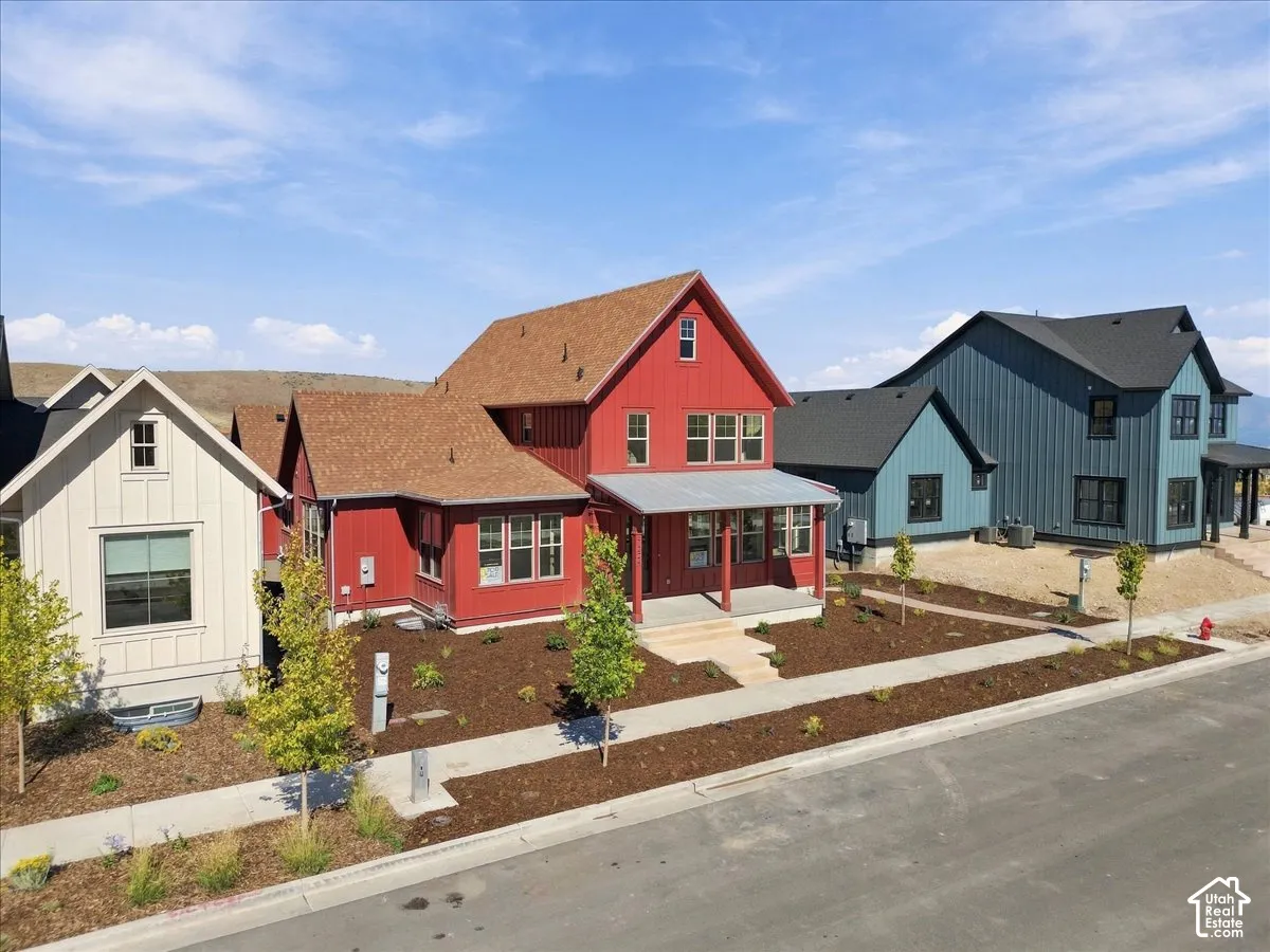 Red exterior with a covered porch