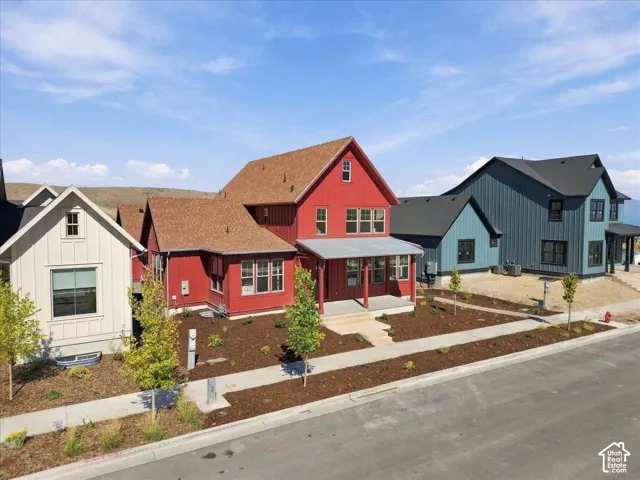 Red exterior with a covered porch