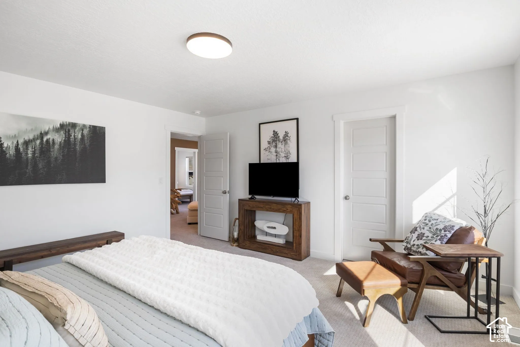 White interior walls with a flush-mount ceiling light