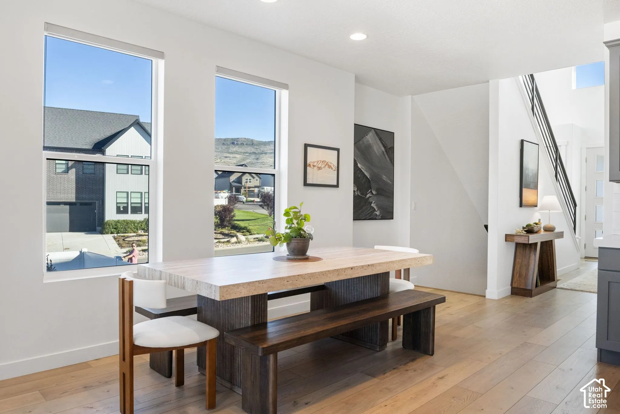 Hardwood-finish flooring, recessed lighting, and a modern staircase with dark railings