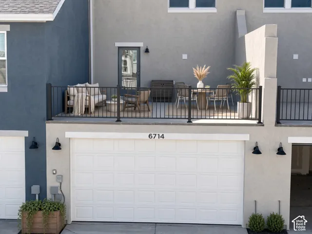 Upper-level outdoor balcony with dark iron railings