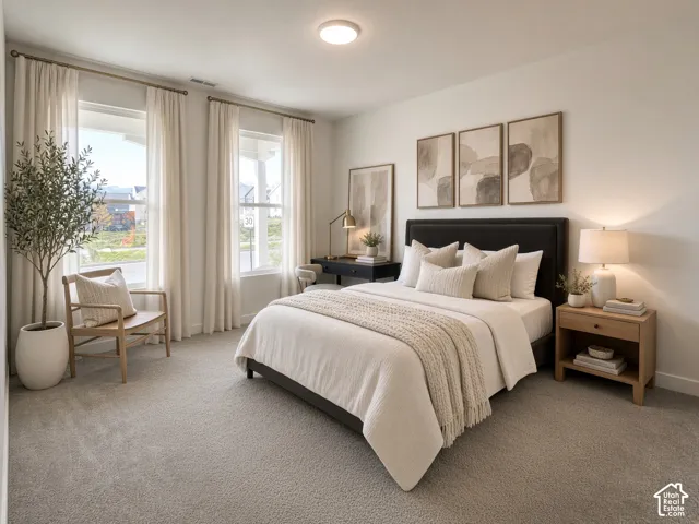 Plush carpet flooring, contemporary light fixture, dual windows, and light-toned walls