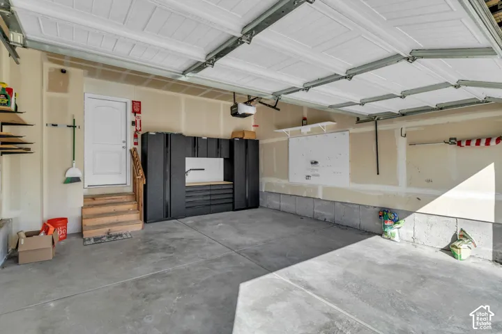 Concrete garage flooring with built-in storage cabinetry
