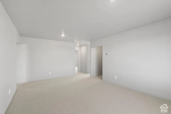 **DISLCAIMER**  Interiors do not show upgrades included. Recessed lighting illuminates neutral carpeting and light-toned walls