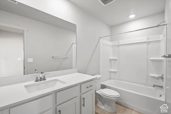 **DISLCAIMER**  Interiors do not show upgrades included. Single vanity with a quartz-finish countertop and integrated sink
