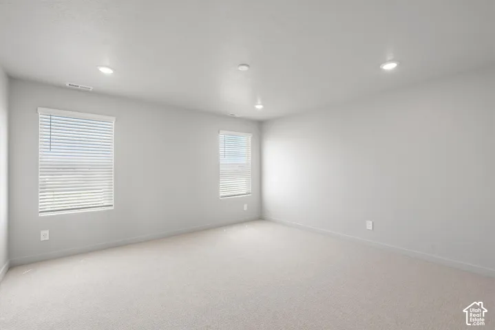 **DISLCAIMER**  Interiors do not show upgrades included. Recessed ceiling lighting illuminates the room with neutral wall tones and plush carpeting