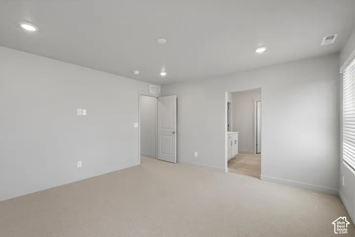 **DISLCAIMER**  Interiors do not show upgrades included. Recessed lighting, light-colored carpeting, light gray wall paint, white interior doors, and a window with blinds