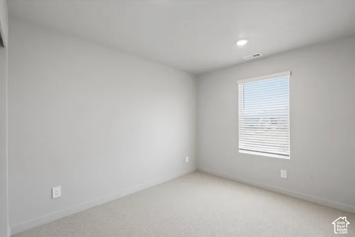 **DISLCAIMER**  Interiors do not show upgrades included. Recessed ceiling lighting, light gray wall finish, window with horizontal blinds, light-colored carpet flooring, white electrical outlets