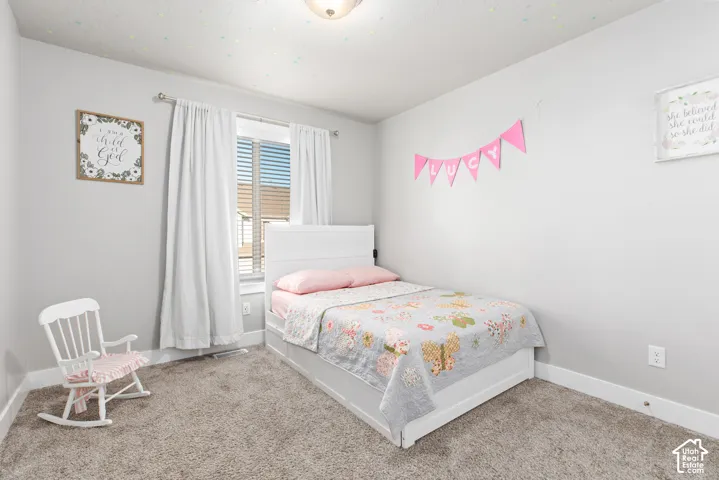 Recessed window with blinds and full-length drapes