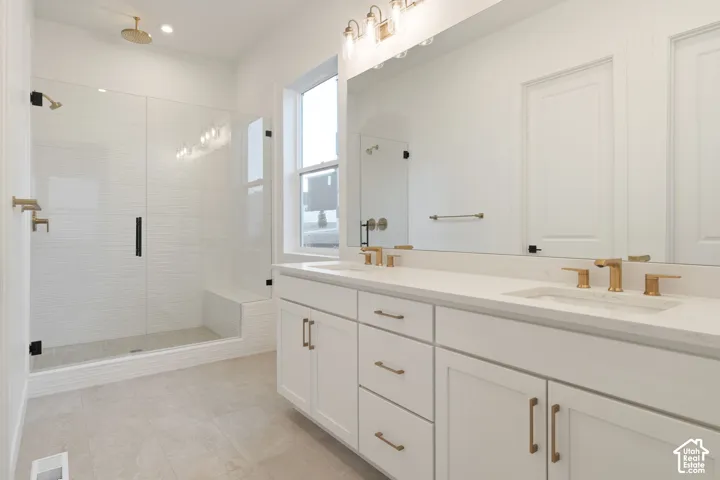 Dual vanity with white cabinetry and integrated sinks