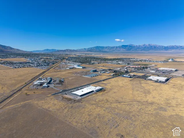 Aerial view of the property and surrounding area