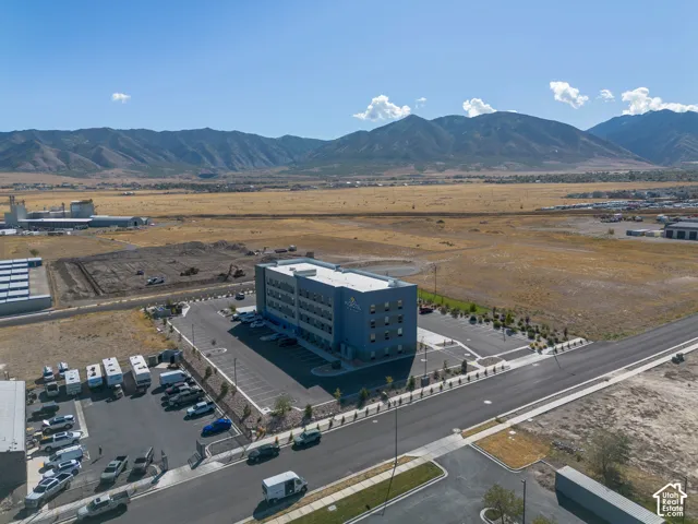 Aerial view of the property and surrounding area