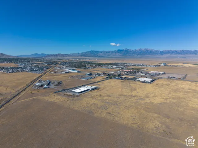 Aerial view of the property and surrounding area