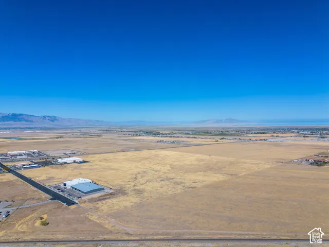 Aerial view of the property and surrounding area