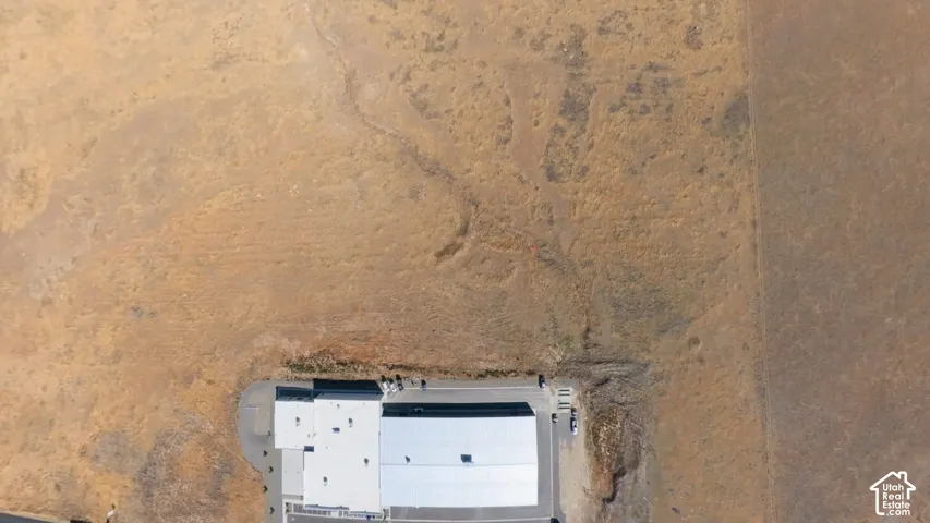 Aerial view of the property and surrounding area