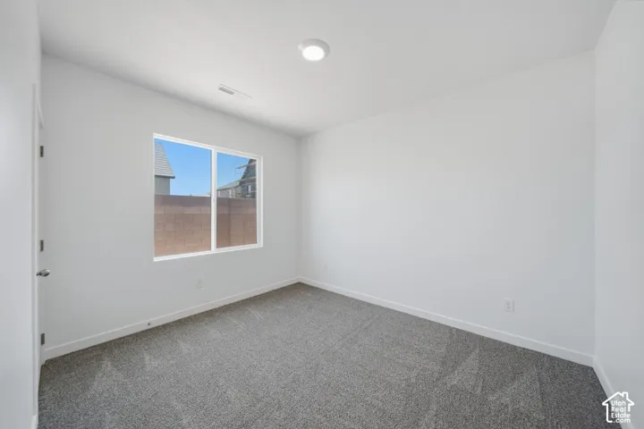 Neutral white walls with a large window