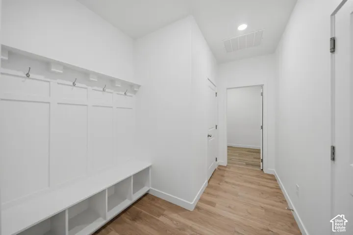 Built-in hall tree with integrated bench seating and shelving