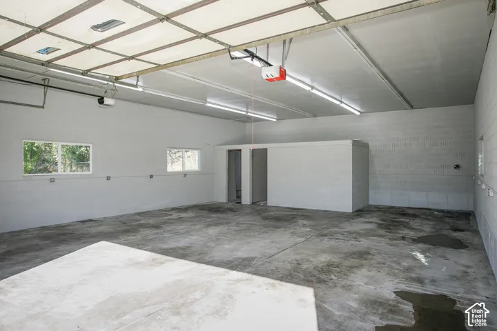 Concrete floor with block walls and multiple windows