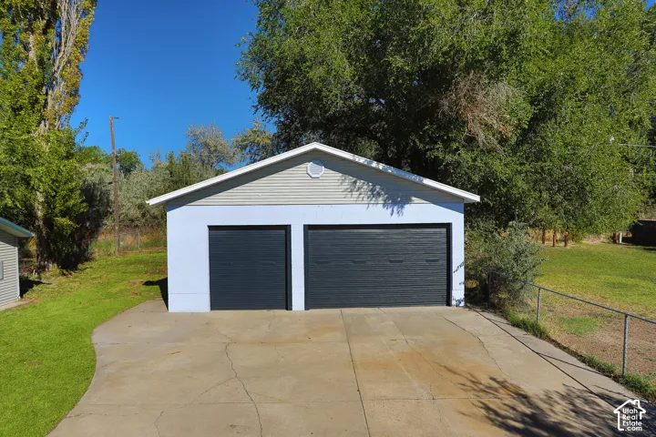 Detached two-car garage with overhead doors
