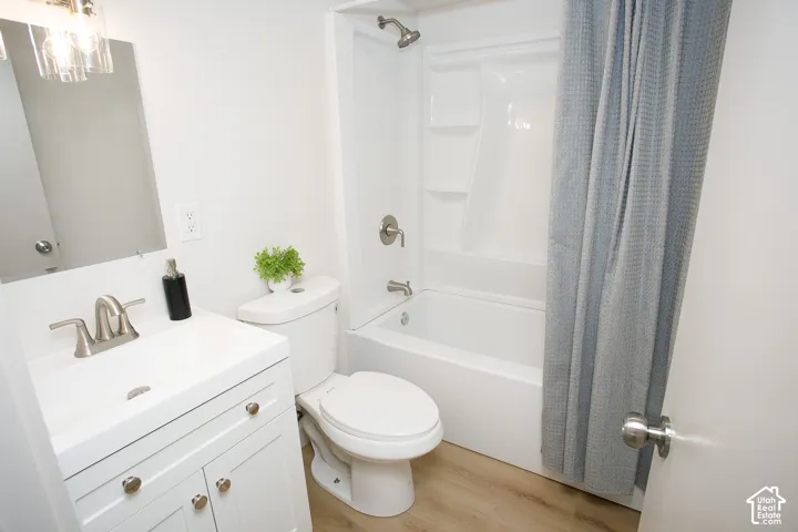 White vanity with a brushed nickel faucet and hardware