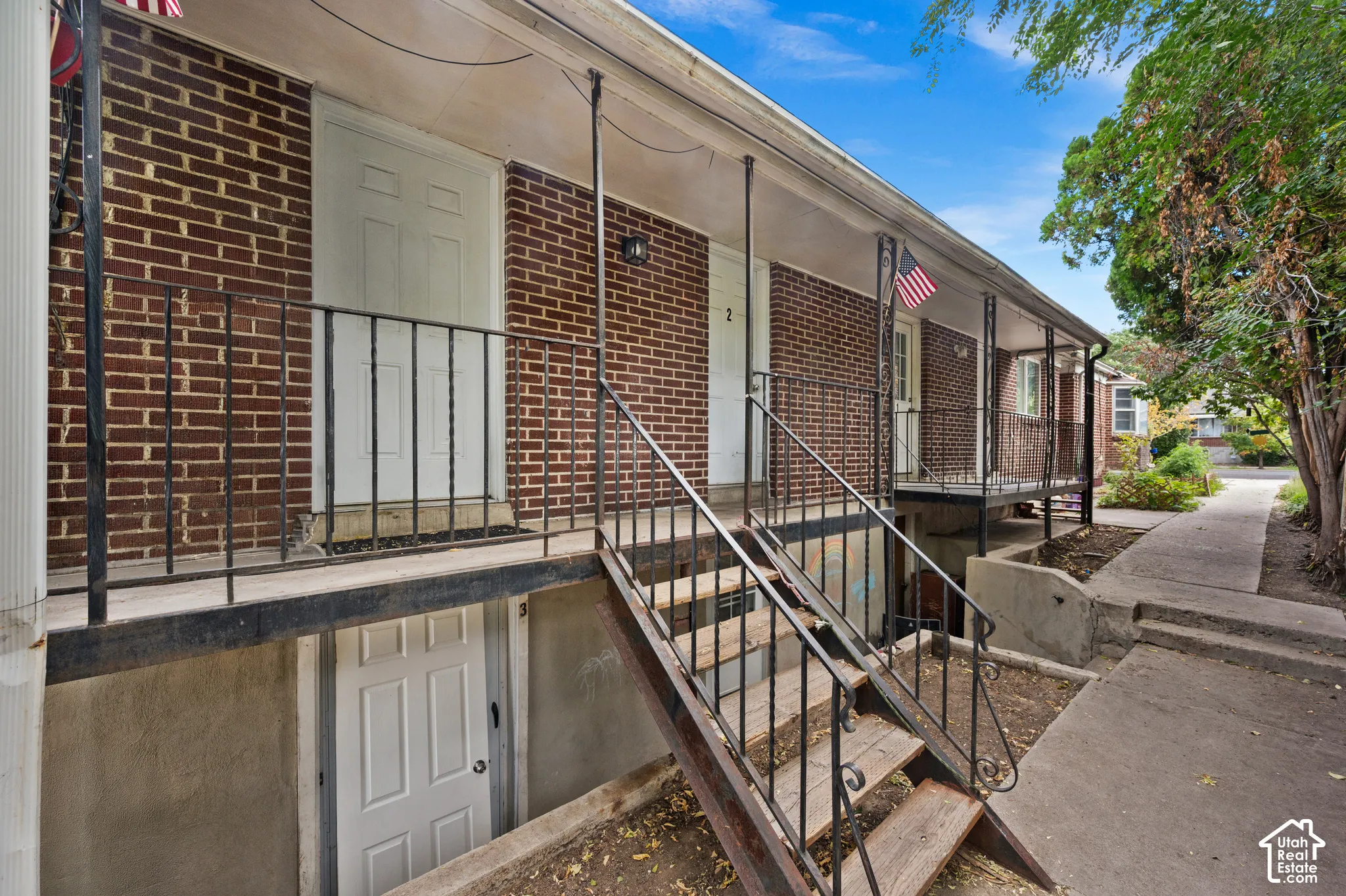 Brick exterior with white doors