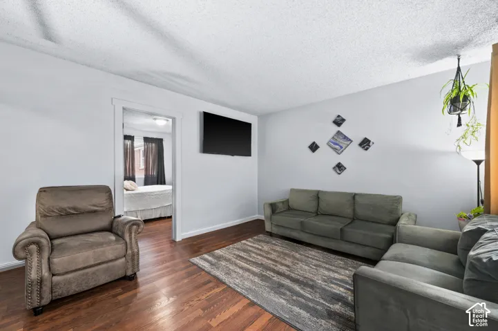 Rich wood-finish flooring complements light-toned walls