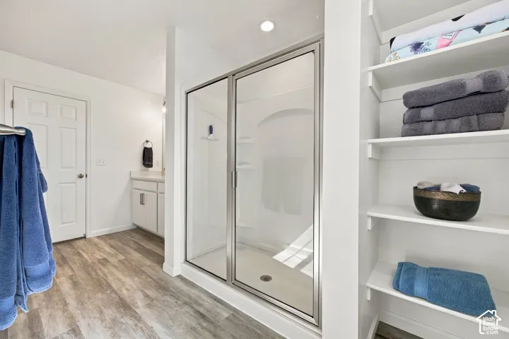 Primary shower with glass door.