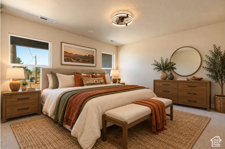 Recessed lighting and a modern ceiling fan fixture illuminate the space