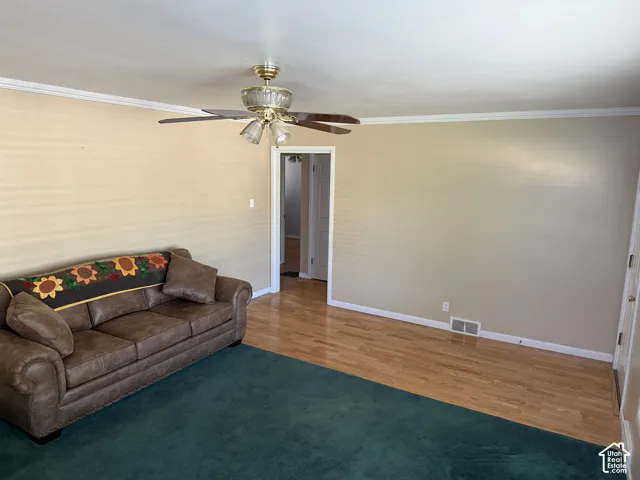 Hardwood flooring paired with a ceiling fan
