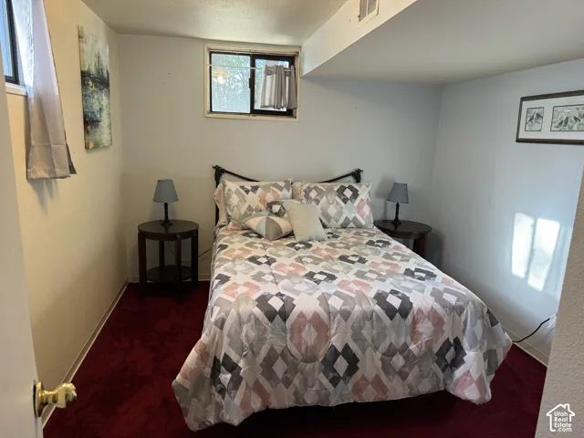 Carpet flooring, recessed window, and white wall finishes