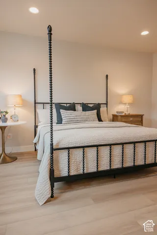 Neutral-toned walls paired with light wood-finish flooring and recessed ceiling lighting