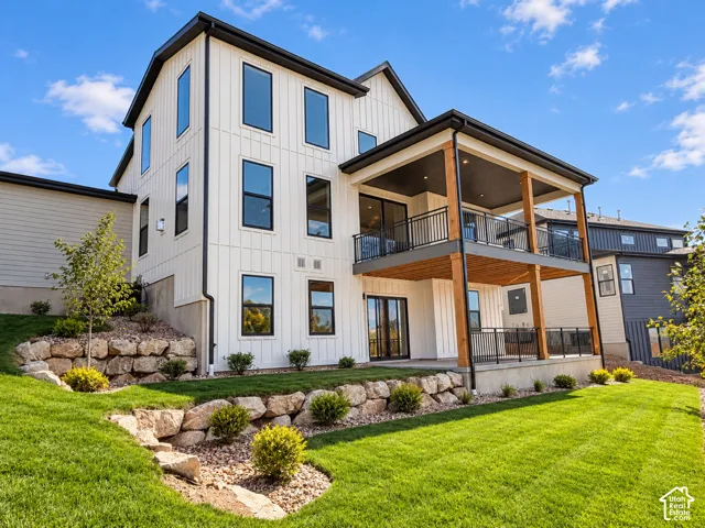 Board and batten exterior with black-framed windows. Lighting enhanced with ai.